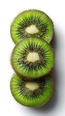 Sliced kiwis stacked, revealing vibrant green interior