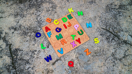 puzzle pieces with word, alphabet wooden board 