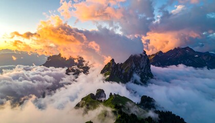 Majestic mountain peaks emerging from a sea of clouds with sunset hues