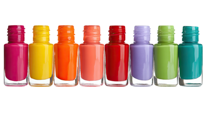 Row of bright nail polish bottles in rainbow gradient on black background