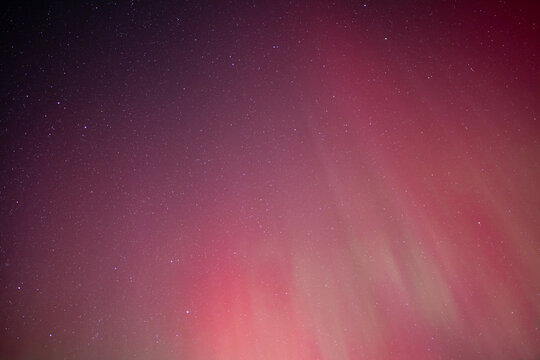 abstract pink background with stars Shows a pink and purple aurora scene. Full-frame composition, pink-purple tone.  - Powered by Adobe
