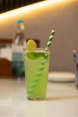 Refreshing Green Lemonade with Striped Straw