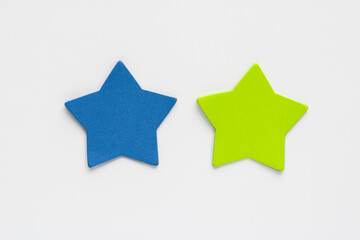 Two star shaped sticky notes or cutouts on a clean background.