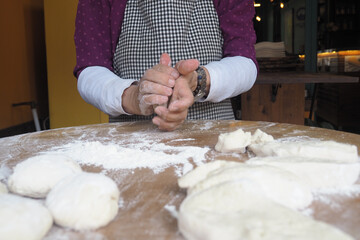 Preparing dough in a cozy kitchen at midday