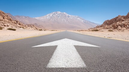 Clearly marked white arrow on asphalt road pavement providing essential directional guidance for drivers and traffic flow.
