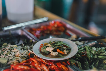 Stir-fried food, being served on a plate, being served on a plate