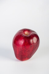 Red apple in hand white background