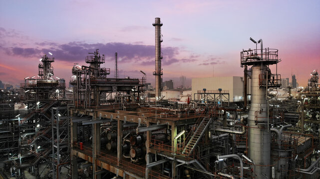Oil and gas industry - refinery factory zone, The equipment of oil refining,Close-up of industrial pipelines of an oil-refinery petrochemical plant at sunset