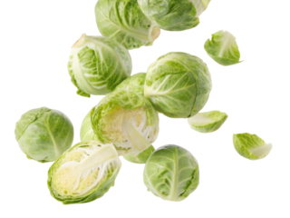 Vibrant toss of fresh green brussels sprout vegetable. healthy raw ingredient for cooking food, isolated and falling for dynamic effect