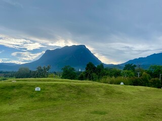Green yard with mountain chiang dao located in Chiang mai northern part of Thailand