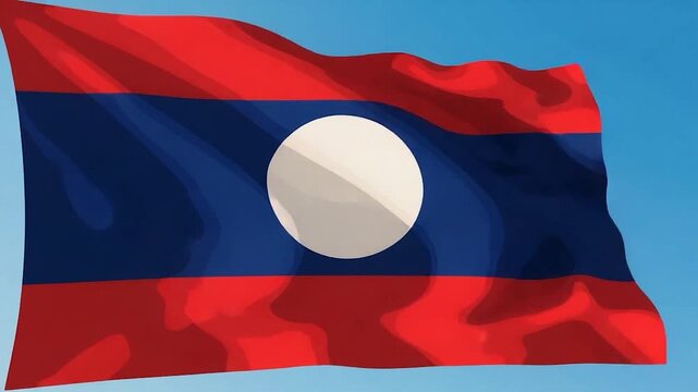 Laos Flag Waving in the Wind Against a Blue Sky.
