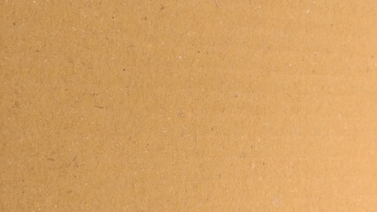 Brown paper texture background for presentation product. Pastel peach illumination, grainy color gradient background