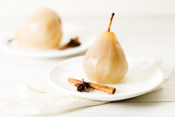 Poached pears with spices in syrup.