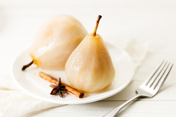 Poached pears with spices in syrup.