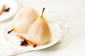 Poached pears with spices in syrup.