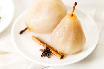Poached pears with spices in syrup.