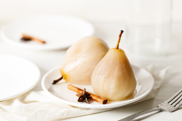 Poached pears with spices in syrup.