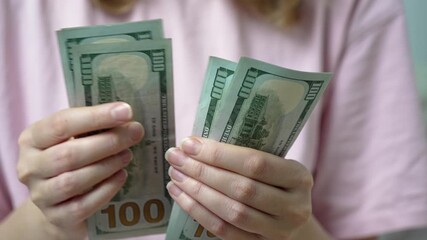 Sick woman counting one hundred us dollar bills to pay for expensive medical services and health insurance, highlighting the high cost of healthcare and financial burden of treatment