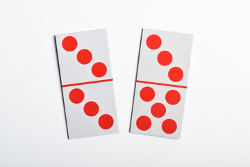 Two classic dominoes isolated on a white background.
