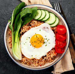 ndonesian nasi goreng (fried rice) served on a plate.