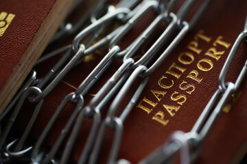 Passports Restricted with Chain - Concept of Travel Restrictions and Immigration Security