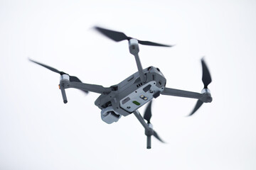 Copter in flight. Drone against the sky.