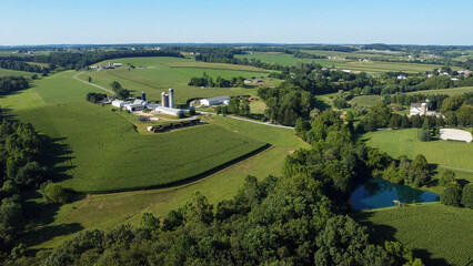 aerial view of agricultural fields, barns and silos on farms in Cochranville, southeastern Pennsylvania © Bo