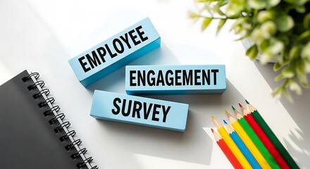 Employee engagement survey concept with wooden blocks and stationery on a white desk, symbolizing feedback and workplace satisfaction