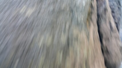 Blurred rock background on river in forest. black and white abstract background. Photo of cold river water in the forest. World Environment Day on June 5th. Shot in a tropical rainforest.