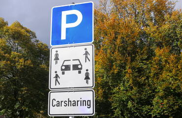 German traffic sign indicating that a parking space is reserved for carsharing vehicles. Symbol for new forms of transportation.