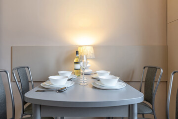 Cozy Minimalist Dining Table with Lamp and White Tableware