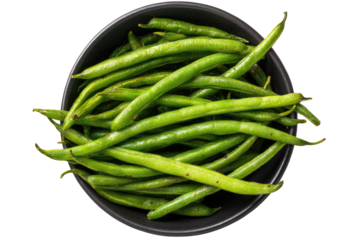 Green beans piled into a dark bowl, top-down view