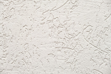 White stucco wall texture background with rough granular pattern. Detailed abstract surface for interior design, building material, or decorative plaster concept.