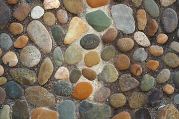 Colorful River Stone and Pebble Surface. Stone and Cement Background