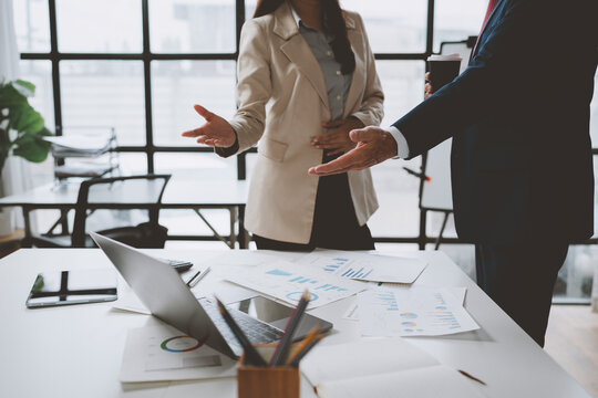 Business professionals discussing strategy during an office meeting
