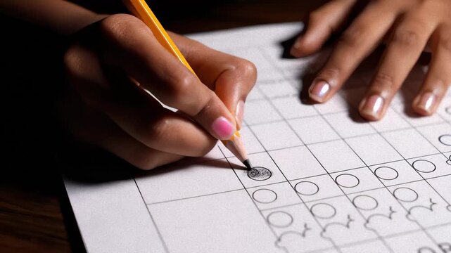 Close Up of Girl Marking Answers on Test With Pencil at Desk