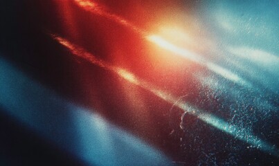 Abstract splash of vibrant red and cool blue paint with textured grain