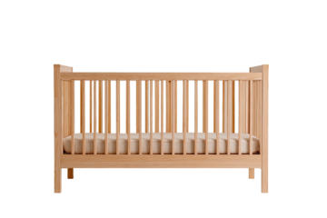 Wood crib with a light mattress, isolated on black