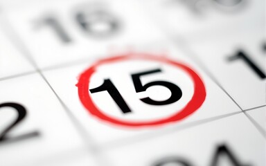 A macro shot of a calendar page with a red circle drawn around the number five, highlighting it. High quality