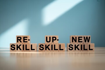 Wooden blocks spell out reskill upskill new skill symbolizing career change and professional development