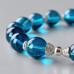 Elegant blue islamic prayer beads on glass jewelry bracelet create calm spiritual focus. An accessory for quiet meditation promoting personal faith and tranquility