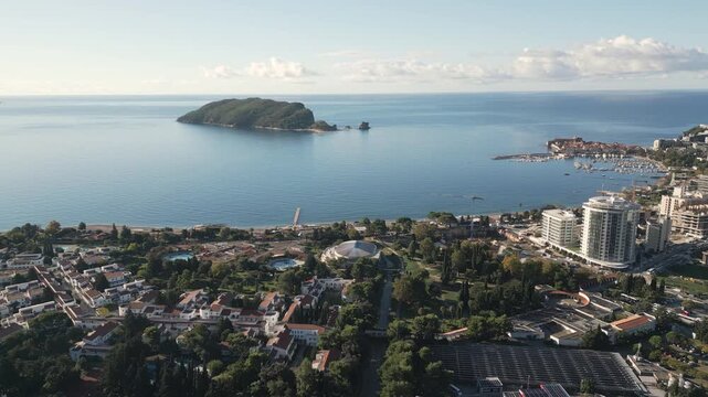 Cinematic drone capture showcase a scenic panorama of Budva, a coastal Adriatic city nestled in southern Crna Gora.