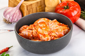 Raw marinated uncooked chicken wings