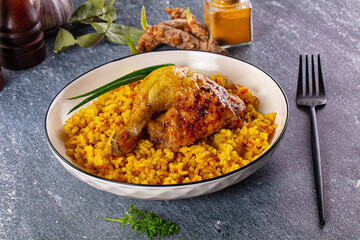 Roasted chicken leg with yellow rice