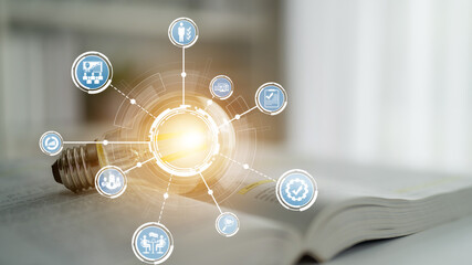 A glowing light bulb symbolizes innovation and creativity, surrounded by technology icons, set...