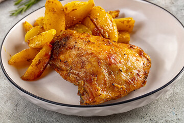 Roasted chicken thighs with baked potato