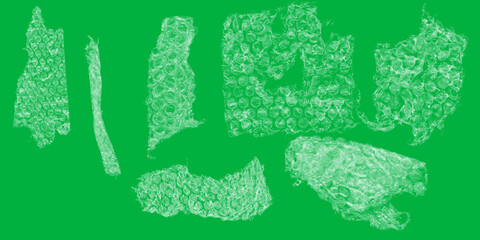 A whimsical collection of shimmering bubble wrap pieces dancing against a vibrant green backdrop...