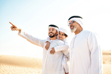 Three generation family making a safari in the desert of Dubai
