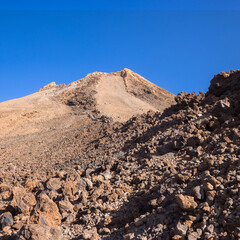 Exploring El Teide Summit's Rocky Terrain Under Clear Blue Skies, Spain