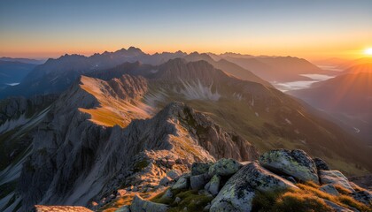 Obraz premium Golden Sunrise Light Over Rugged Alpine Mountains Panorama